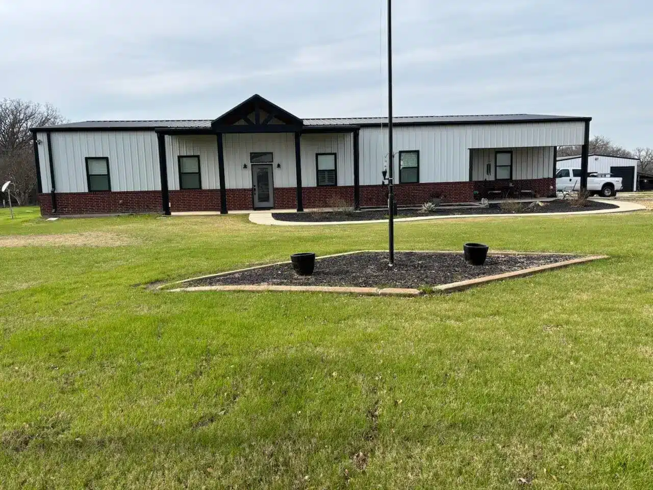 custom-built barndo in Texas for a client with massive green front yard