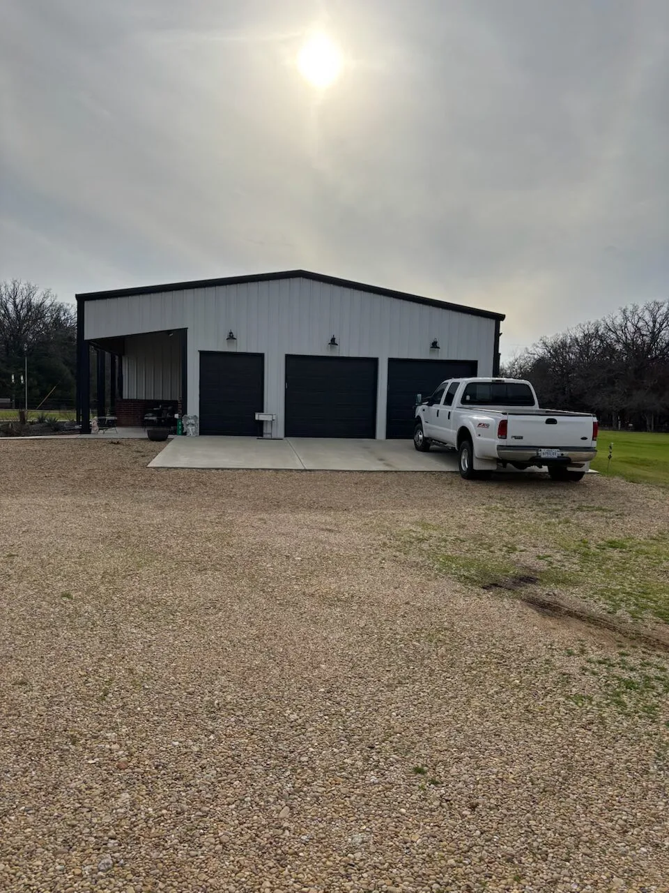 Our truck parked outside a clients metal barndominium build in Austin, Texas.
