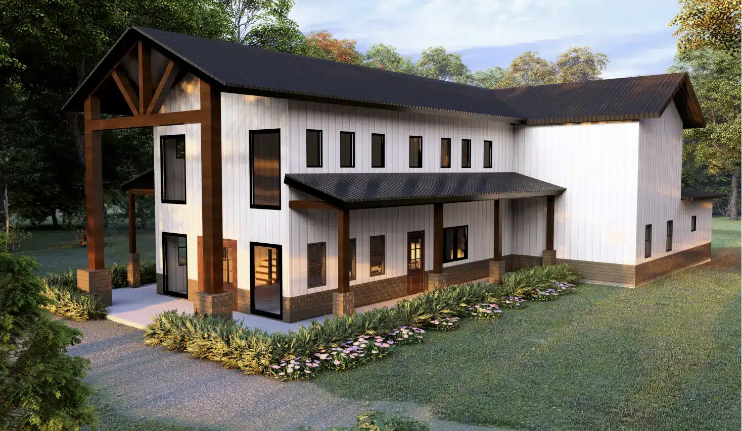Modern white barndominium with dark brown roof surrounded by greenery.