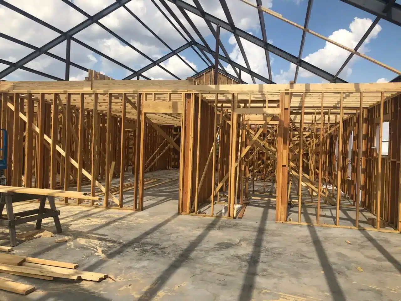 Framed barndominium structure under construction with beams