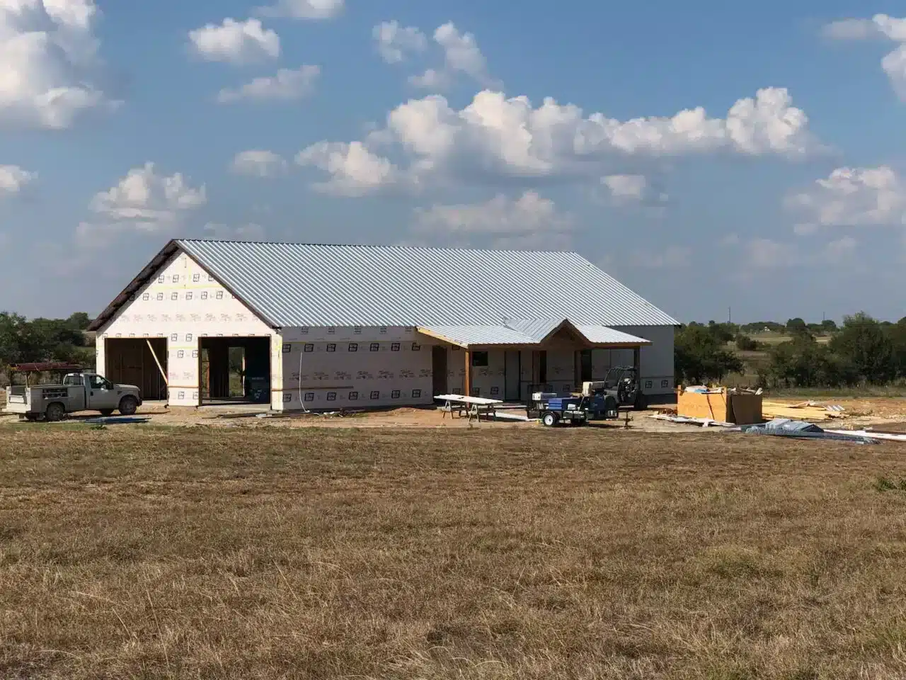 Custom white and light grey barndo built in rural part of Texas