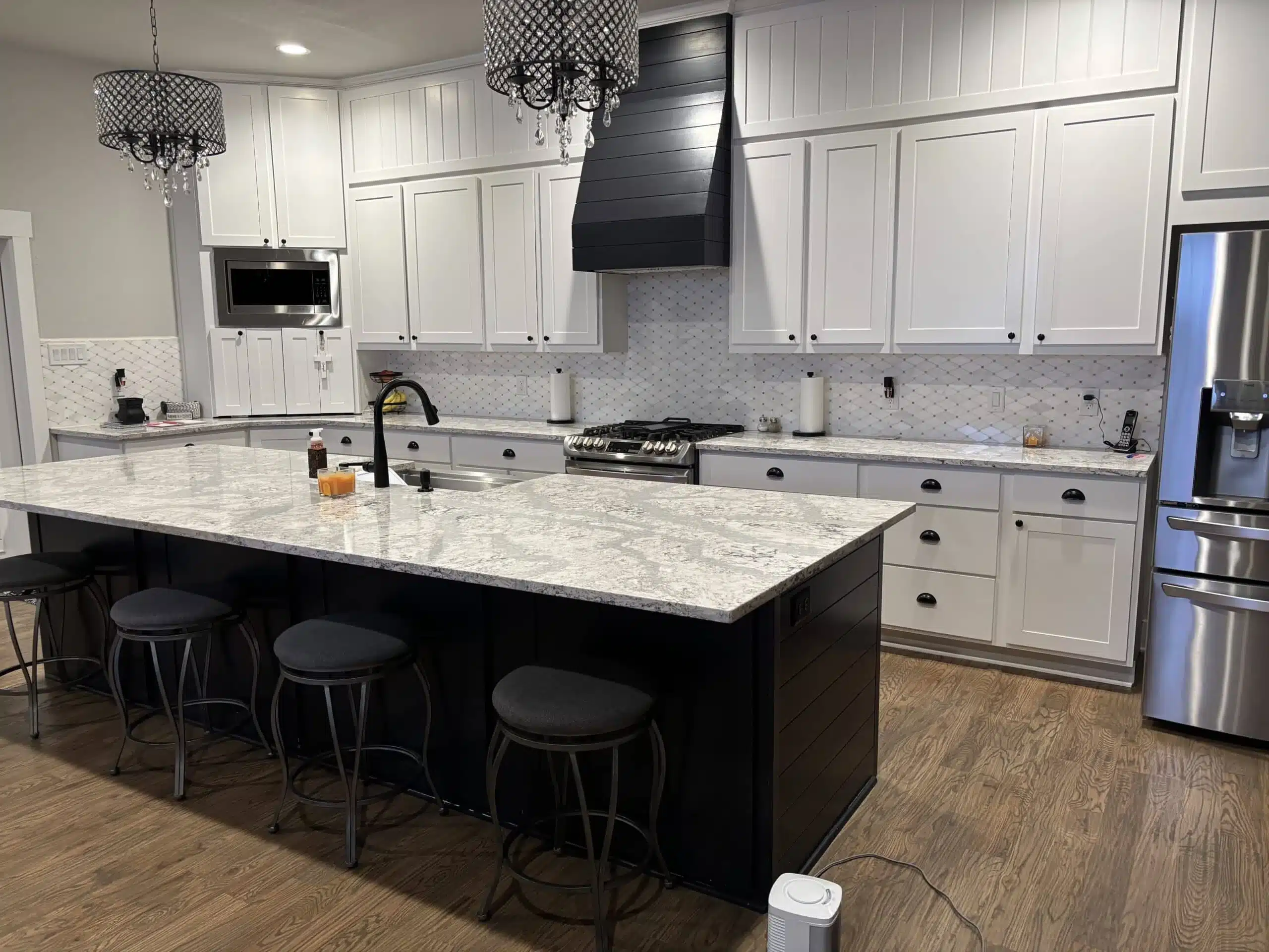 Finished barndominium kitchen with a large island, completed as part of a turnkey build
