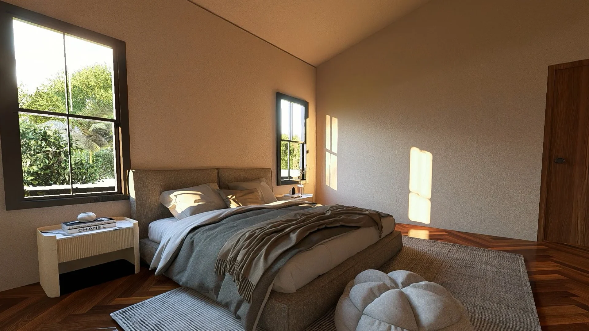 Primary bedroom in The Timberhaven barndominium featuring a large upholstered bed, wooden flooring, neutral finishes and black-framed windows.